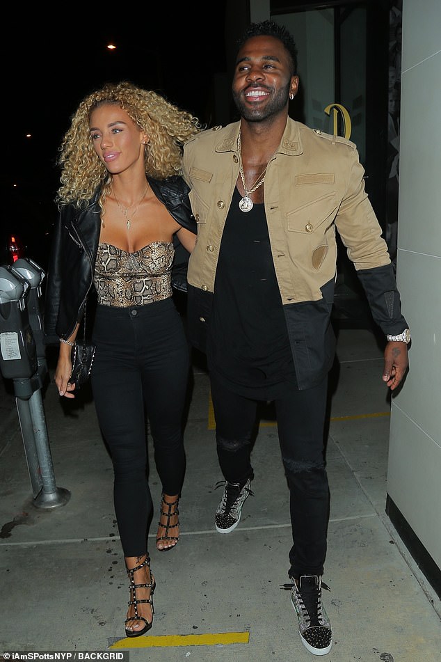 Jason Derulo matches his girlfriend Jena Frumes in a tan jacket as the