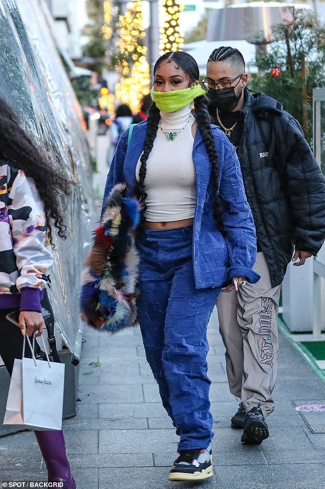 Saweetie rocks braids and double-denim look in Beverly Hills… after teasing duet with Cardi B ...